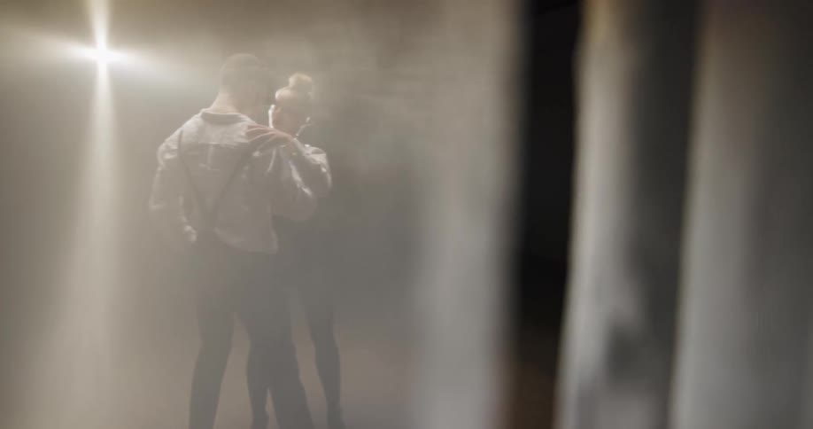 A man and woman dancing indoors