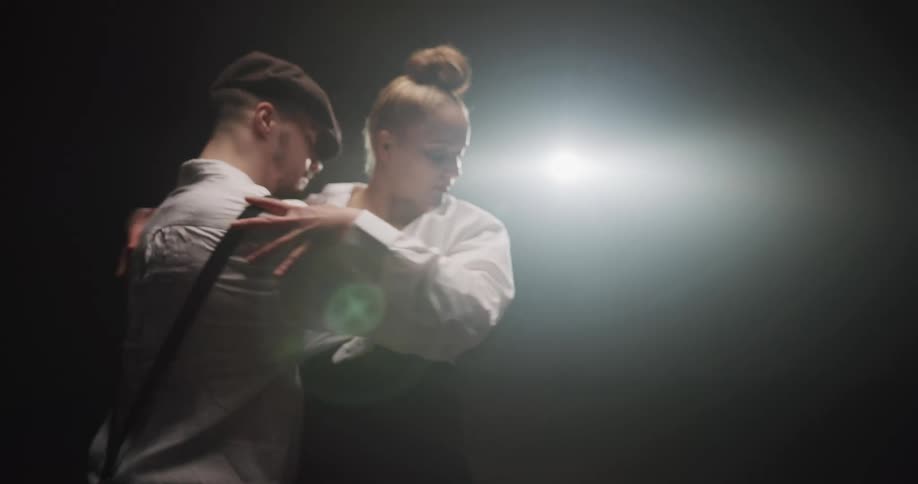 A man and woman dancing in a studio
