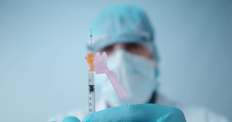 A close up of a syringe leaking fluid