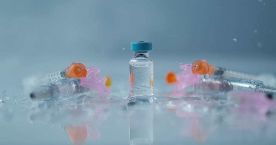 Injection and tubes are shattered on a table