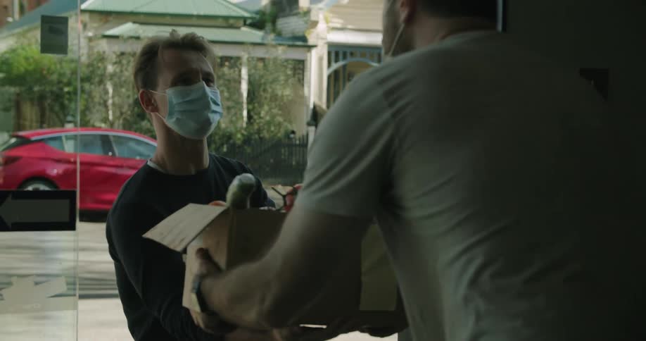A man delivers a box of vegetables