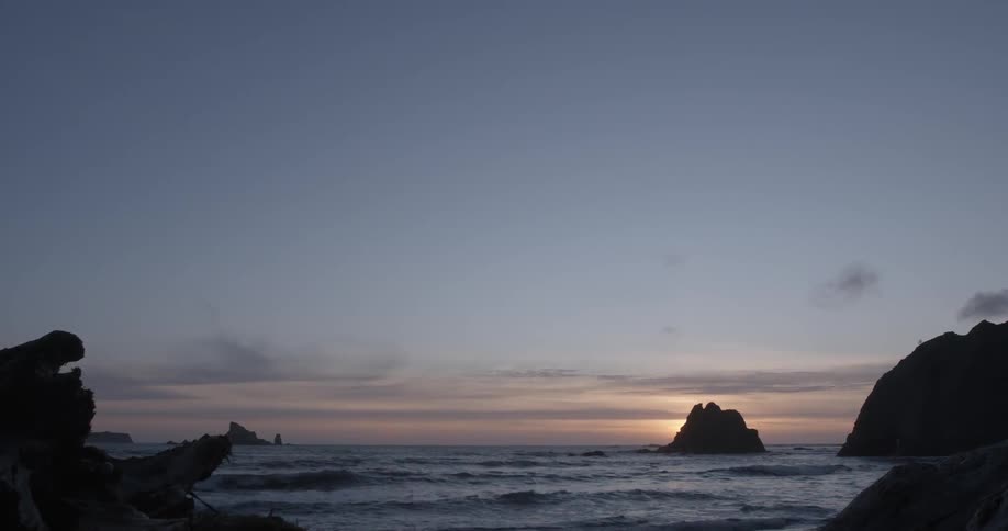Waves washing to shore at sunset