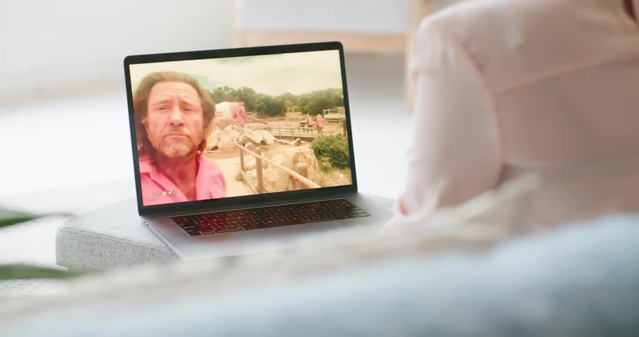 A woman talking to a man via video call