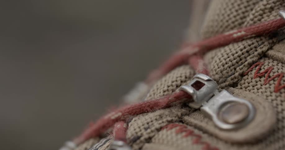Boot laces are pulled tightly