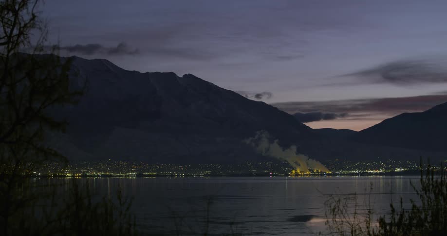 A shot of a power plant across a lake at night