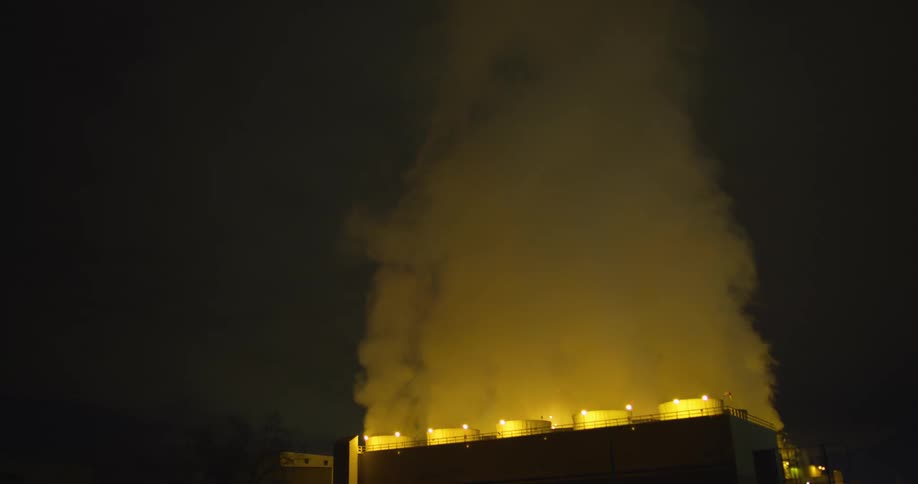 The steam rises from the power plant