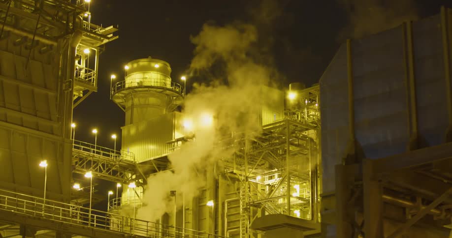 Smoke billowing out of a factory
