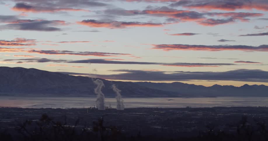 The smoke rises from industrial area in the town