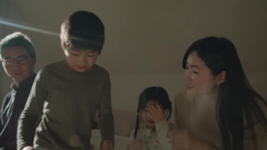 A family talk and use devices in the bedroom