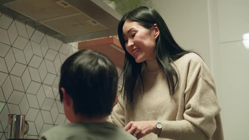 A woman and child cooking together