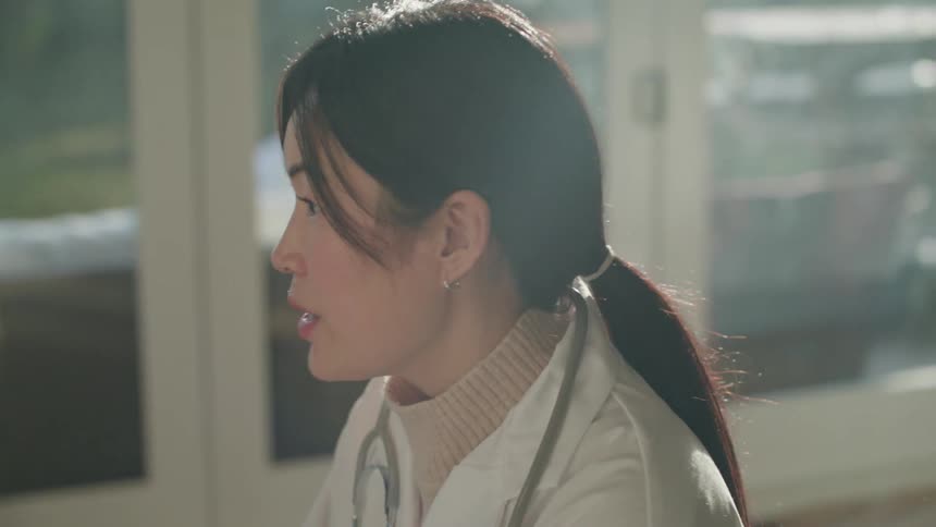 A woman doctor sitting
