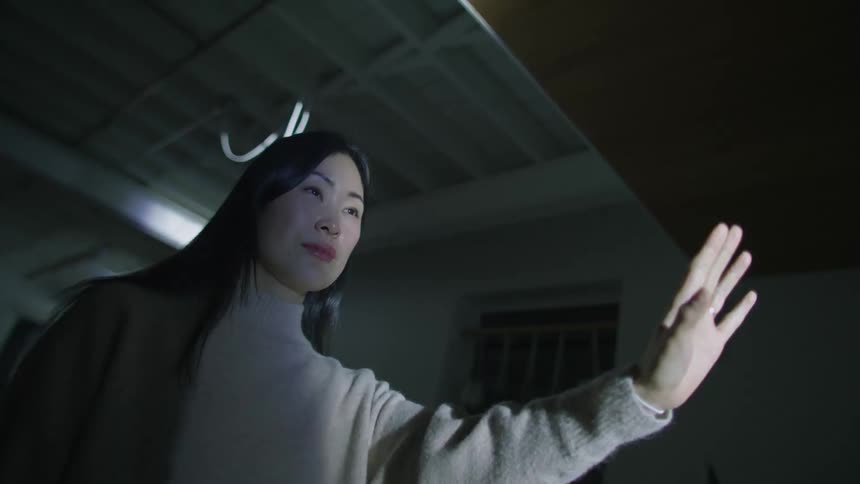 A woman standing in a strobe light