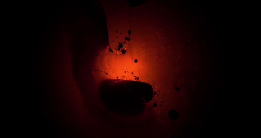 A bubble floating in front of a light