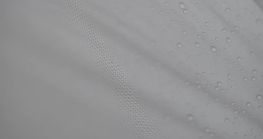 Inside a tent water is on the outside