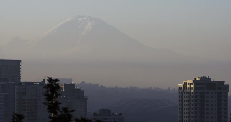 View from the tops of buildings of a tall mountain in the distance