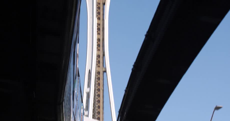 View of a train passing then a tower above
