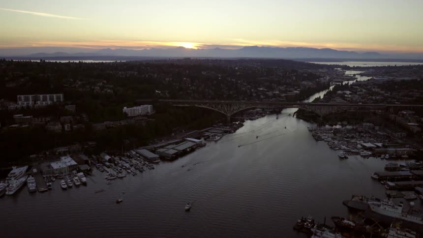 Aerial view of a port town with a bridge in the middle