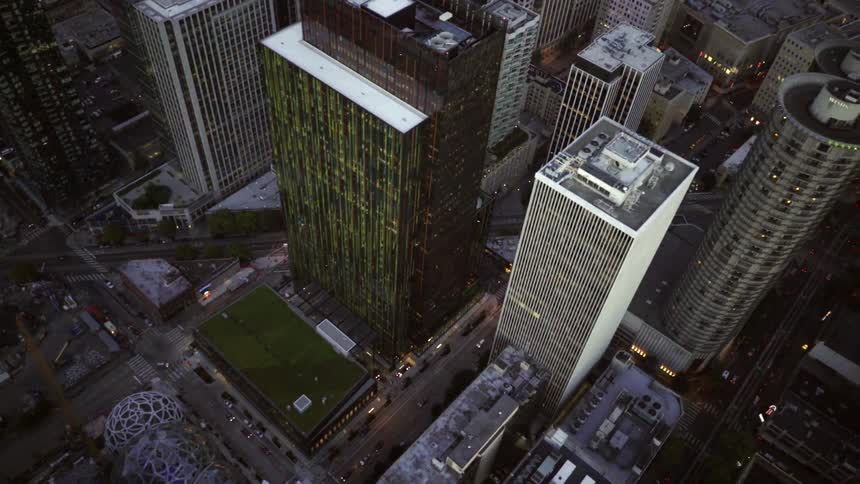 Aerial view of a city with cars driving below