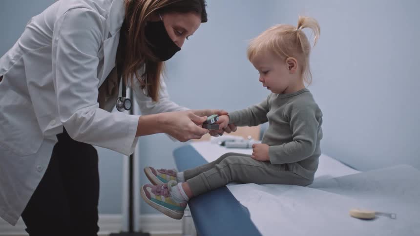 A child is having a check up in a doctors office