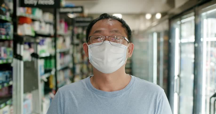 An employee of a store standing in an aisle