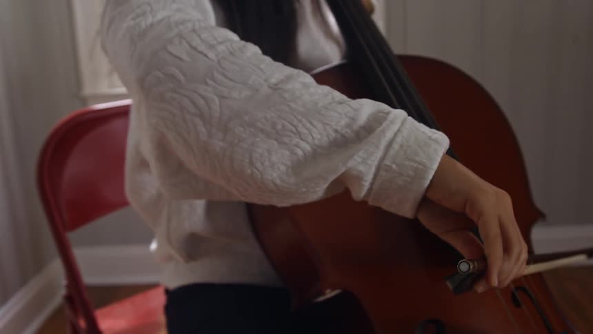 A woman plays the cello