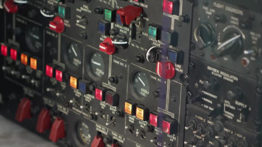A close up of a plane control panel