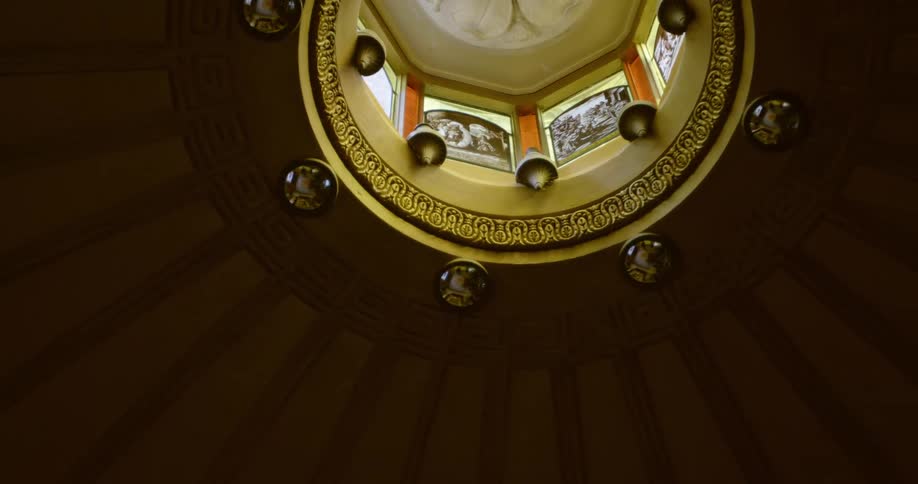 An elaborate gold domed ceiling
