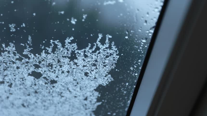 Snow building up on a car window