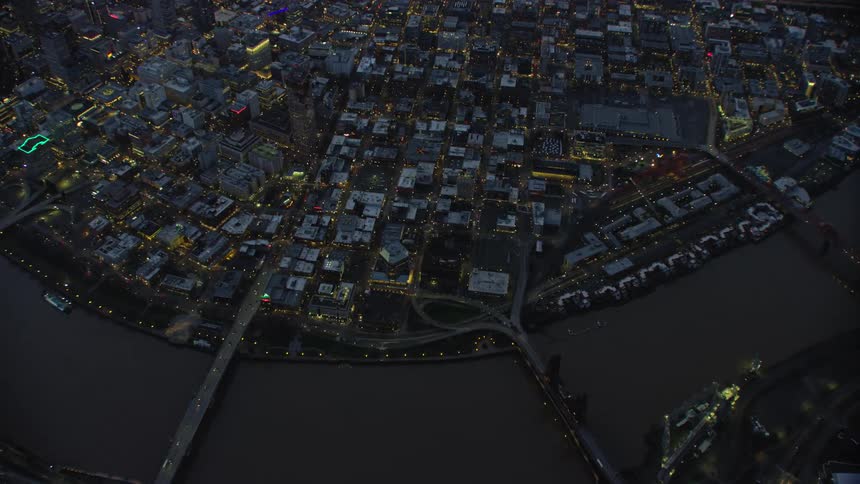 Blue hour aerial looking down on the Willamette River in downtown Portland, Oregon before most of the city lights turn on afte a busy day