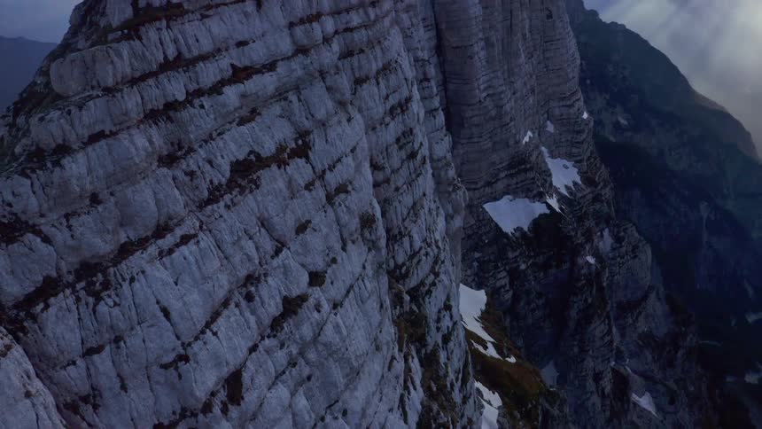 A wide shot of a mountain cliff