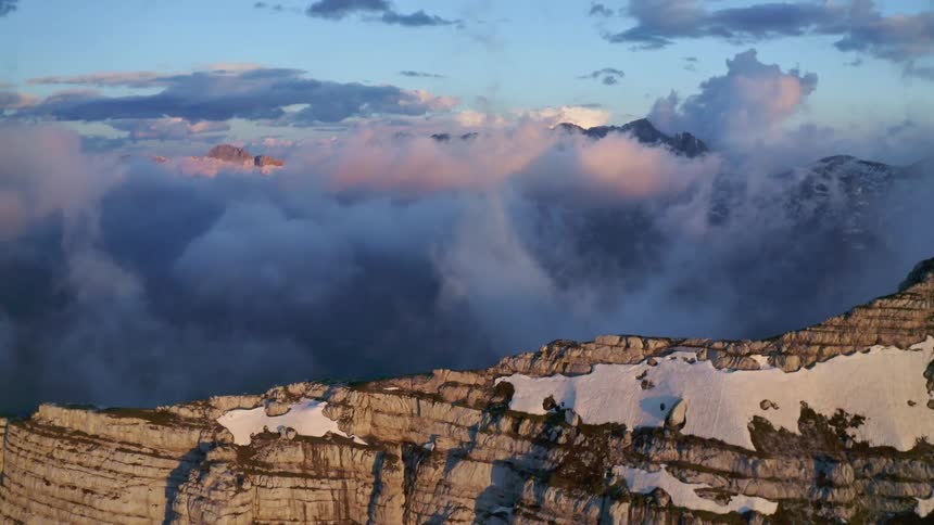 Dense clouds surround a canyon and obscure the valley
