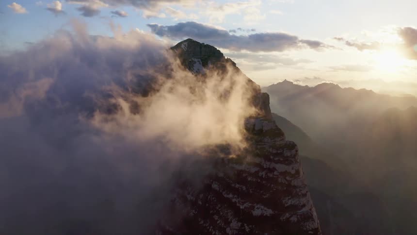 Aerial view of mountains at dusk is displayed