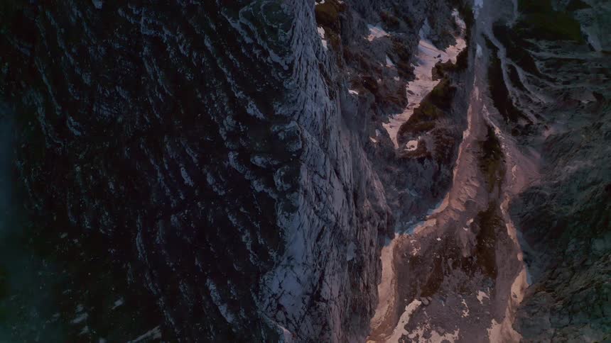An aerial view of a rocky mountain range in nature