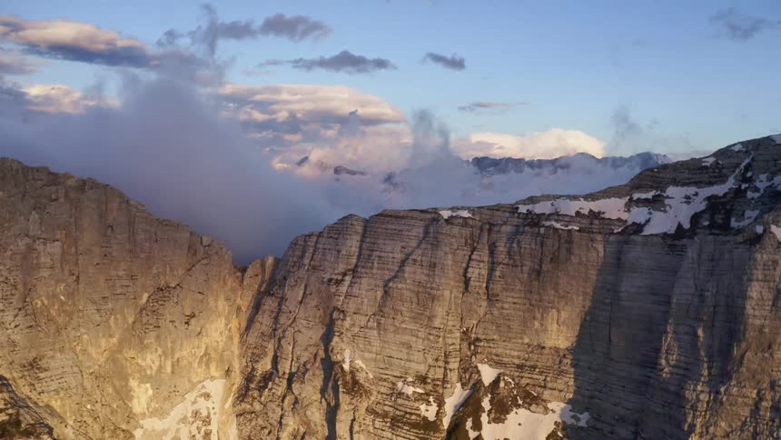Snow settles on the summit of a canyon