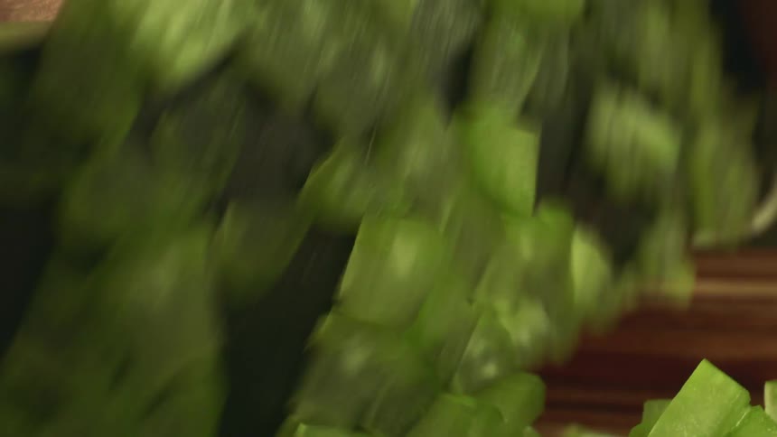 A close up of a person cutting up food
