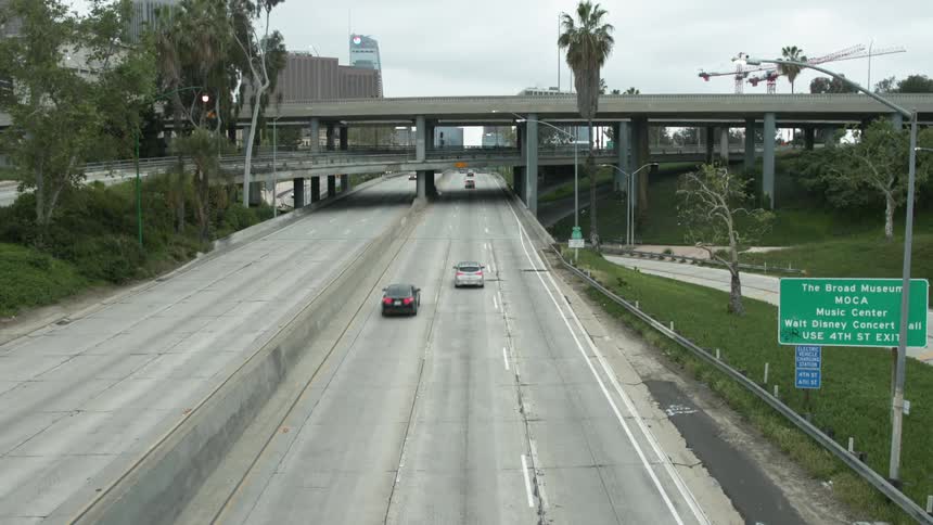 Cars driving down a road on a highway