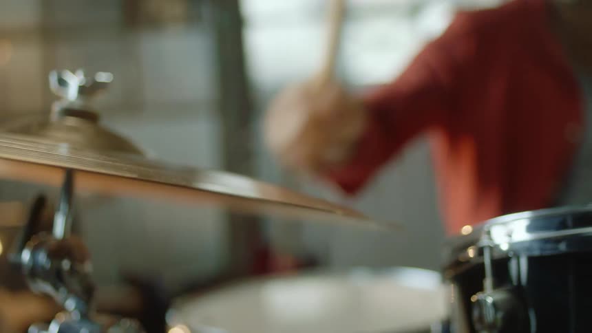 A person playing the drum set