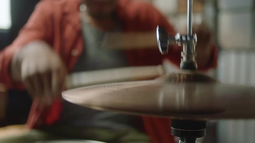 A man playing the drum set