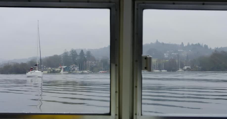 A panning shot of a boat on the water