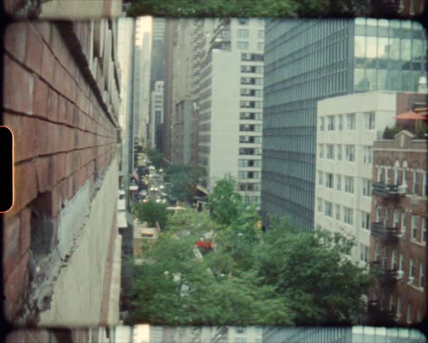 Footage of an urban city is displayed in spring