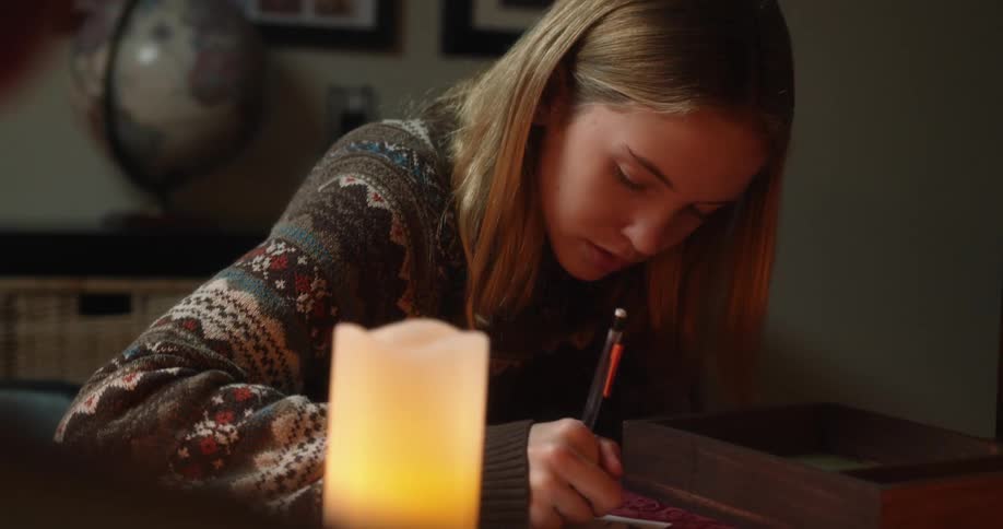 A woman writing on a paper