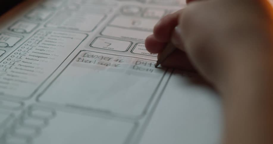 A person is writing on a piece of paper
