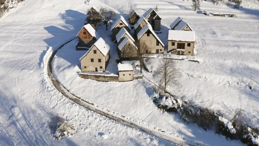 Aerial view of houses in winter is displayed