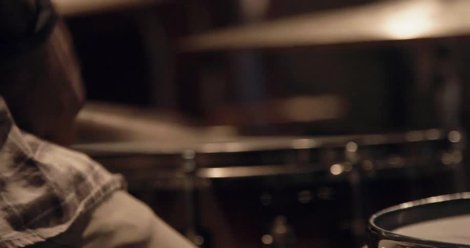 A person plays drums