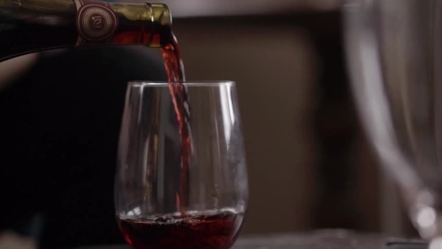 Red wine being poured into a glass