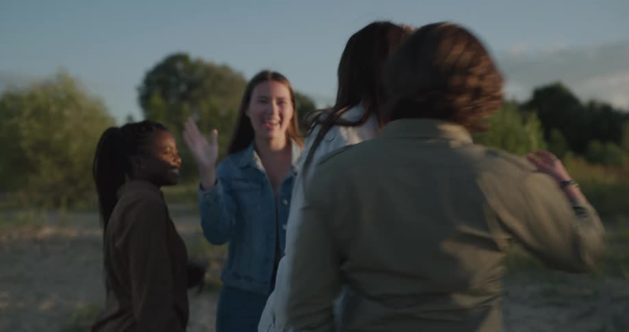 A group of people laughing and hugging