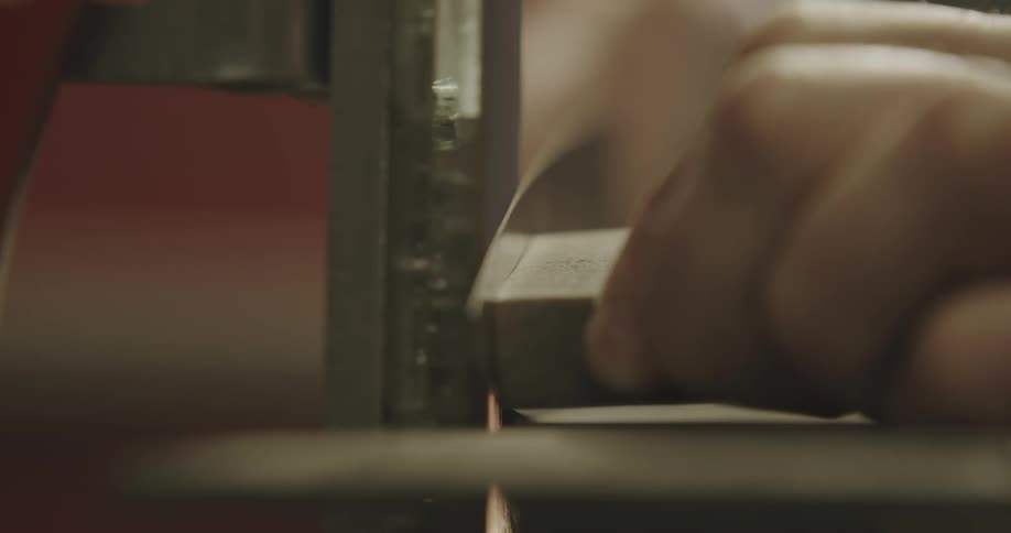 A person is working with machinery indoors
