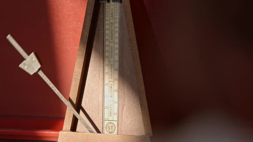 A device is swaying a stick back and forth