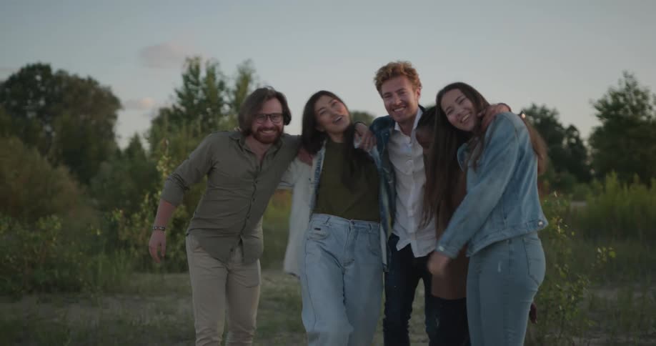 A group of friends poses for photographs on the plain