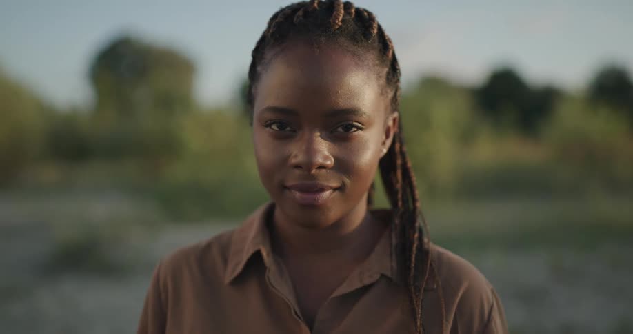 A portrait of a black woman smiling